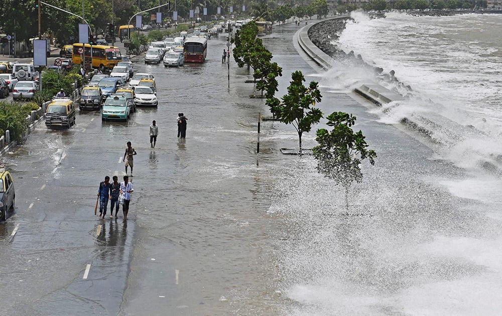 A high tide inundates Marine drive in Mumbai.