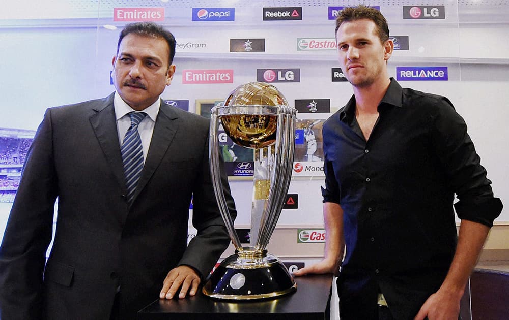 Former Indian captain Ravi Shastri with former Australian cricketer Shaun Tait at the unveiling of the ICC Cricket World Cup trophy in Mumbai.