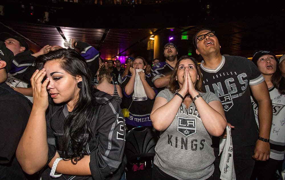 Los Angeles Kings fans react at Club Nokia at L.A. LIVE as they watch Game 4 of the NHL hockey Stanley Cup Finals against the New York Rangers.