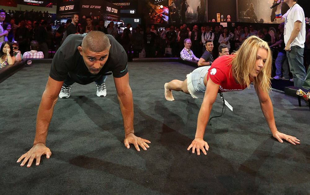 Attendees face off with `Shape Up` at the Ubisoft booth at E3 at the Los Angeles Convention Center.