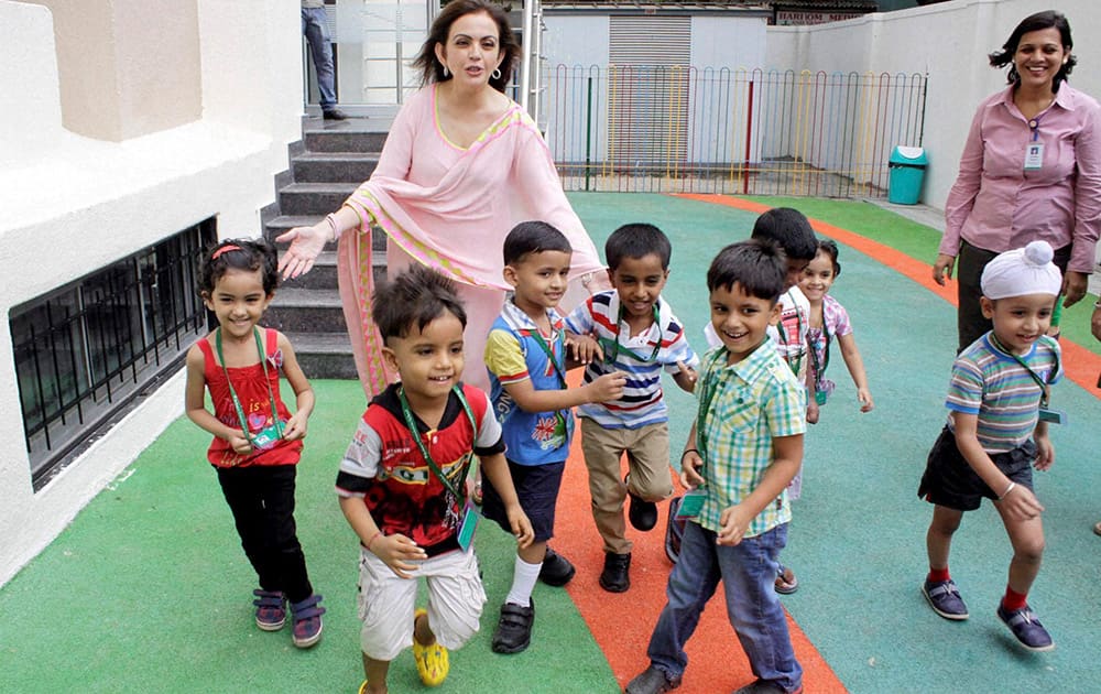 Nita Ambani, Founder & Chairperson, Reliance Foundation with kids at the opening of a Foundation`s school at Koparkhairane, Navi Mumbai.