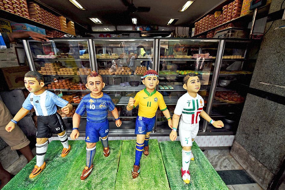 Sweet models of football stars for sale in a sweet shop in Howrah on Wednesday as the football fever gripped the city.