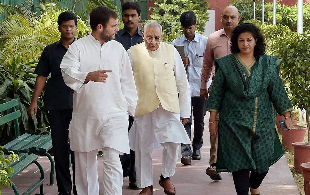 Congress Vice President Rahul Gandhi, Motilal Vora and National President of Mahila Congress Shobha Ojha arrive for a meeting of All India Mahila Congress leaders during the National Council meet at AICC office in New Delhi.