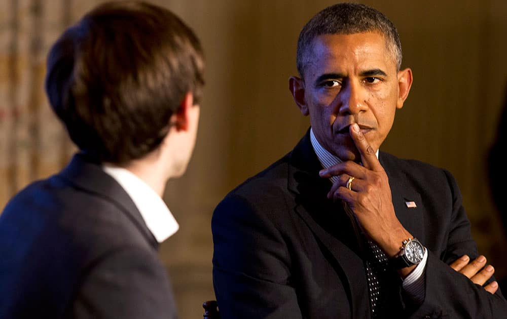 President Barack Obama listens to a question during a Tumblr forum from the State Dining Room of the White House in Washington, moderated by Tumblr Founder and CEO David Karp, left. During the forum Obama conceded he was ashamed as an American and terrified as a parent that the United States can`t find it in its soul to put a stop to rampant shooting sprees. 