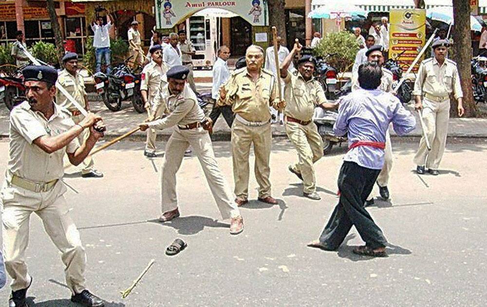 Police lathi charge milk producers during their protest at the headquarters of dairy major Amul ,in Anand, Gujarat on Tuesday demanding an increase in their remuneration. 