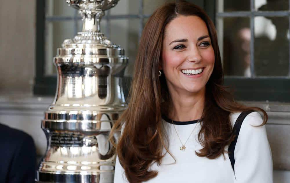 Briatin`s Kate, Duchess of Cambridge stands next to teh America`s Cup as she listens to a speech during the launch of British challenger team for the 35th America`s Cup at the National Maritime Museum in Greenwich, London.