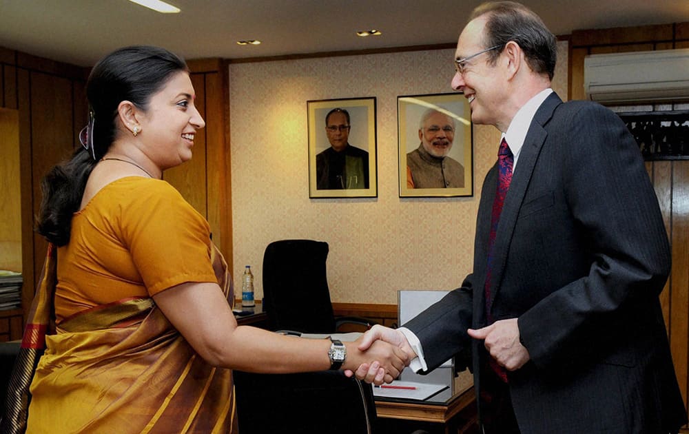 British High Commissioner to India, Julian Evans with Union Minister for Human Resource Development, Smriti Zubin Irani during a meeting in New Delhi.