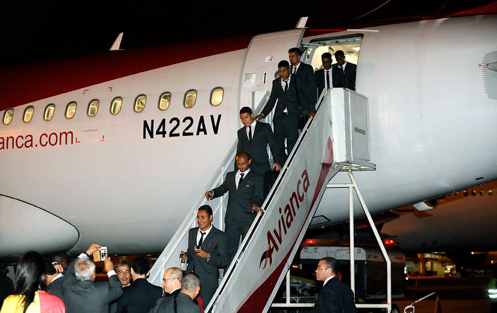 Players from Costa Rica`s soccer team exit a plane as they arrive at the Sao Paulo International airport, Brazil.