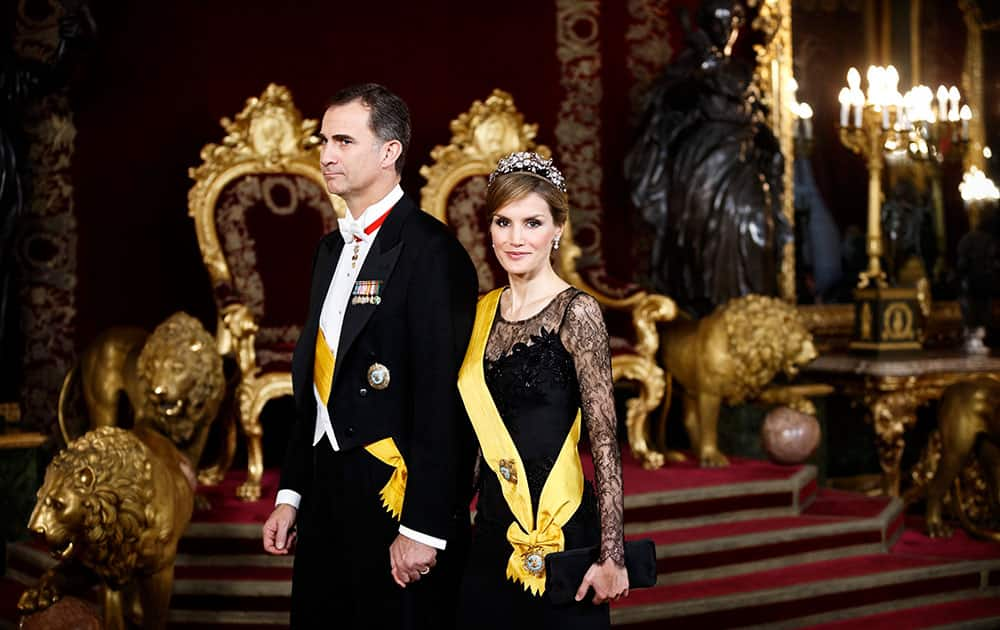 Spanish Princess Letizia and Spanish Crown Prince Felipe walk trough the Throne room as they attend a welcome ceremony before a gala dinner for Mexico`s President Enrique Pena Nieto, at the Royal Palace, near Madrid.