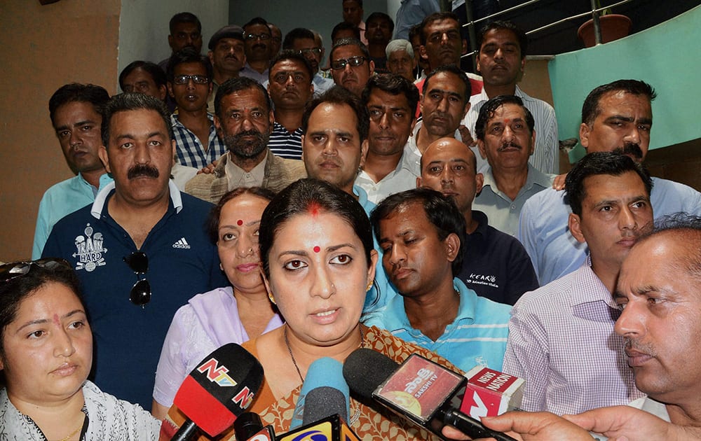 Union Human Resource Development Minister Smriti Irani talks to the media in Mandi on Monday, a day after 24 engineering students of Hyderabad were washed away in the Beas river. 