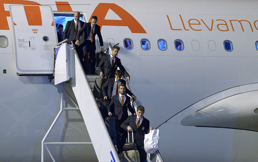 Members of the Spanish national soccer team arrive at the international airport Alfonso Pena in Curitiba, Brazil.