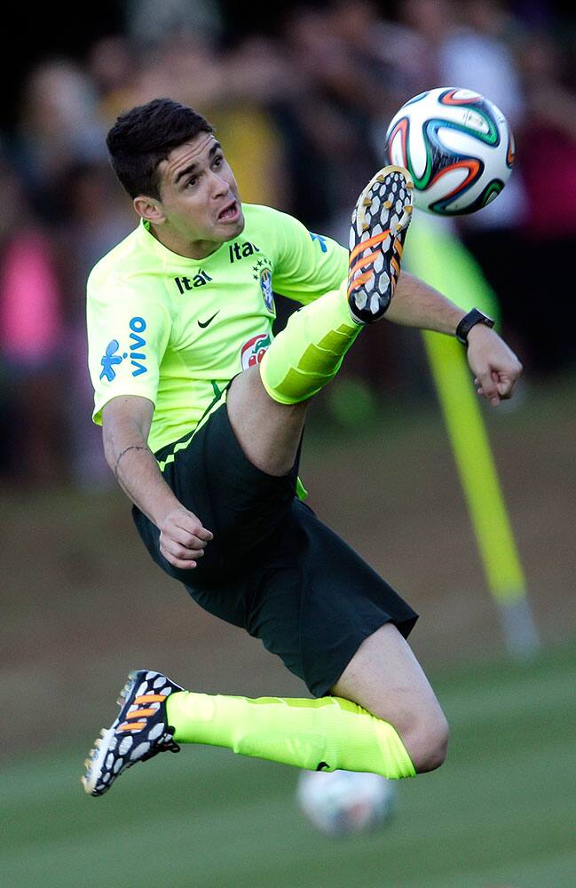 Brazil`s national soccer team player Oscar controls the ball during a training session at the Granja Comary training center in Teresopolis, Brazil.