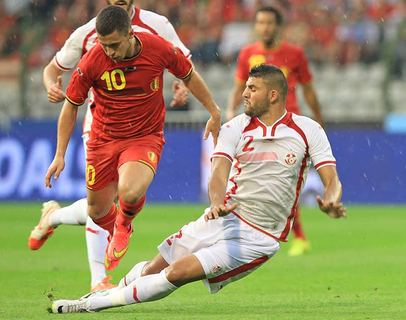 Tunisia`s Syam Ben Youssef, right, tries to tackle Belgium`s Eden Hazard, during a friendly soccer match at the King Baudouin stadium in Brussels.