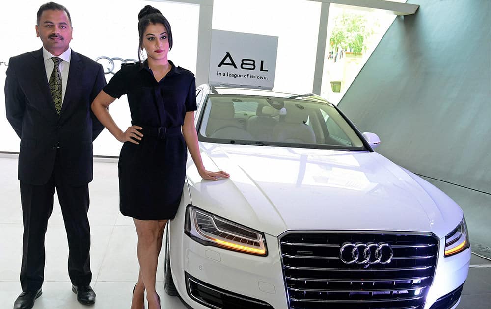 Audi Chennai CEO K Subramanian and actress Taapsee launching the new A 8L in Chennai.