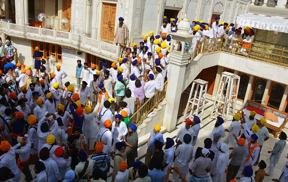 Members of a hardline Sikh group clash with guards of the Sikh’s holiest shrine, the Golden Temple, in Amritsar.