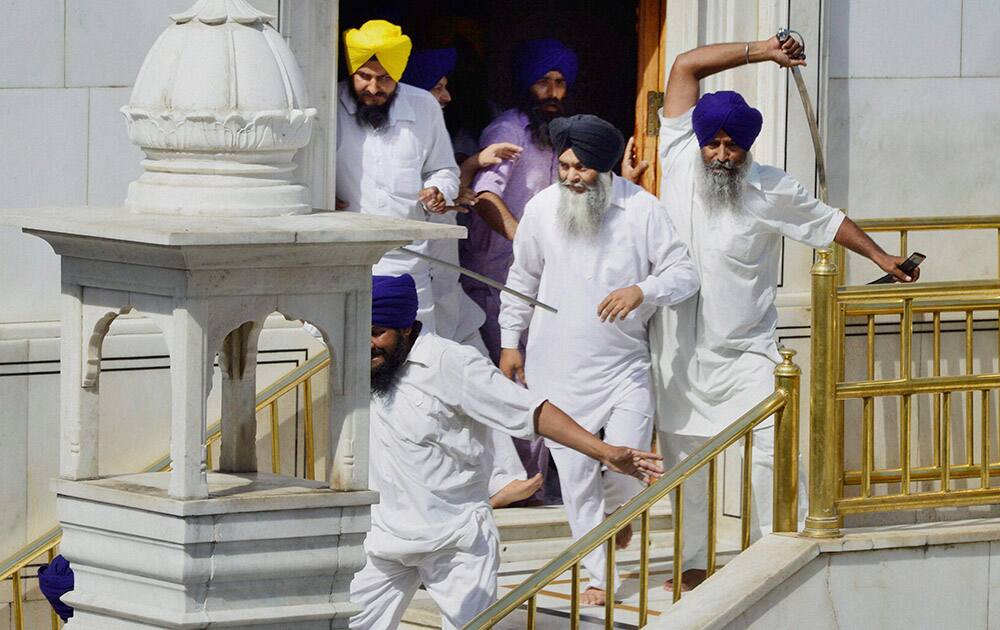 A scene of clash between SGPC supporters and a radical Sikh organisation on the30th anniversary of Operation Bluestar, at Golden Temple Complex in Amritsar.