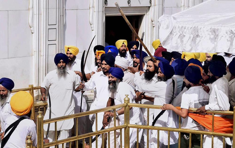 A scene of clash between SGPC supporters and a radical Sikh organisation on the 30th anniversary of Operation Bluestar, at Golden Temple Complex in Amritsar.