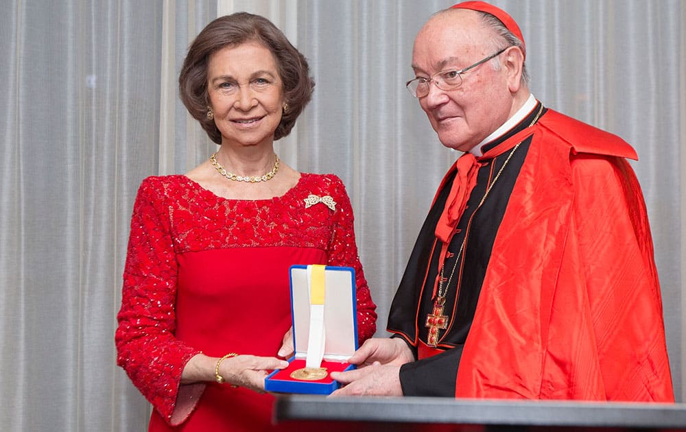 Queen Sofia of Spain accepts the Path to Peace Award medal from Catholic Cardinal Renato Raffaele, right, at a ceremony by the Path to Peace Foundation at the United Nations headquarters.