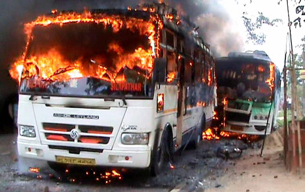 Two buses set on fire by local people resulting in death of one person at Ghoramari near Tezpur.