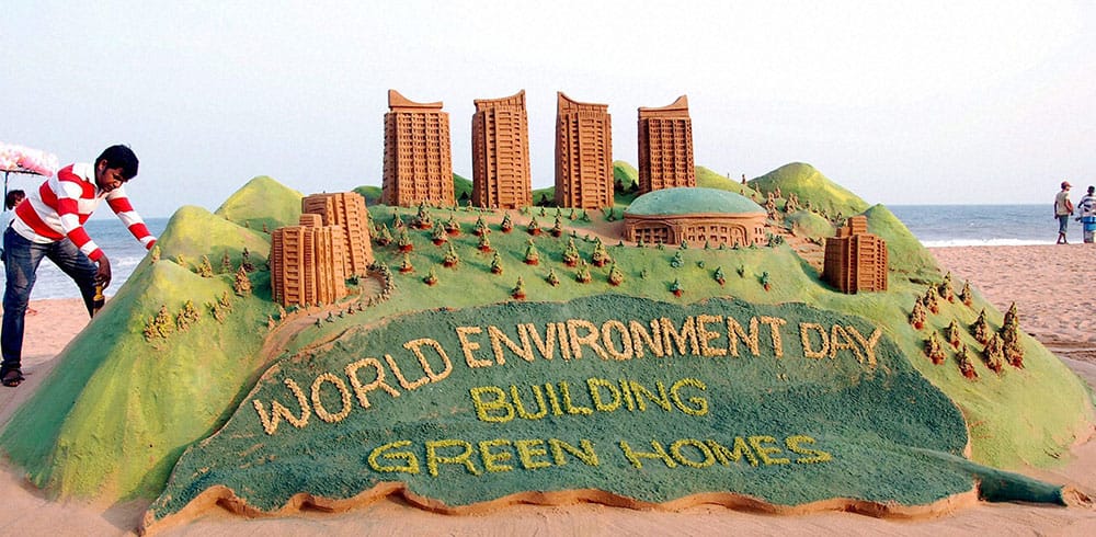 Sand artist Sudarsan Pattnaik creates a sand sculpture with a message.