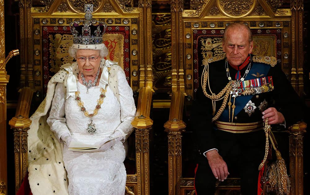 Britain`s Queen Elizabeth II, left, sits with Prince Philip, the Duke of Edinburgh, as she delivers her speech in the House of Lords, during the State Opening of Parliament, at the Palace of Westminster, in London.