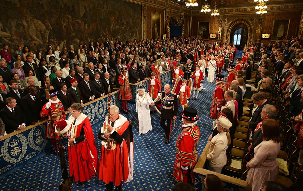 Britain`s Queen Elizabeth II,centre left, and Prince Philip, centre right, proceed through the Royal Gallery during the State Opening of Parliament in the House of Lords at the Palace of Westminster in London.