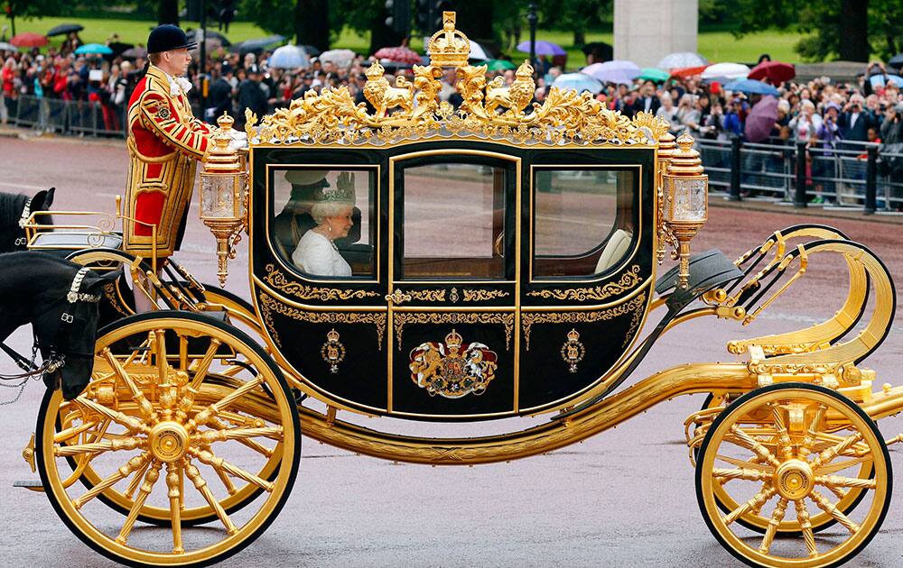 Queen Elizabeth II and The Duke of Edinburgh leaves Buckingham Palace, in the new Diamond Jubilee State coach, to deliver her speech at the Palace of Westminster, in London.