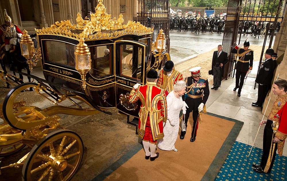 Britain`s Queen Elizabeth II arrives in the new Diamond Jubilee State coach, to deliver her speech, at the Palace of Westminster , in London.