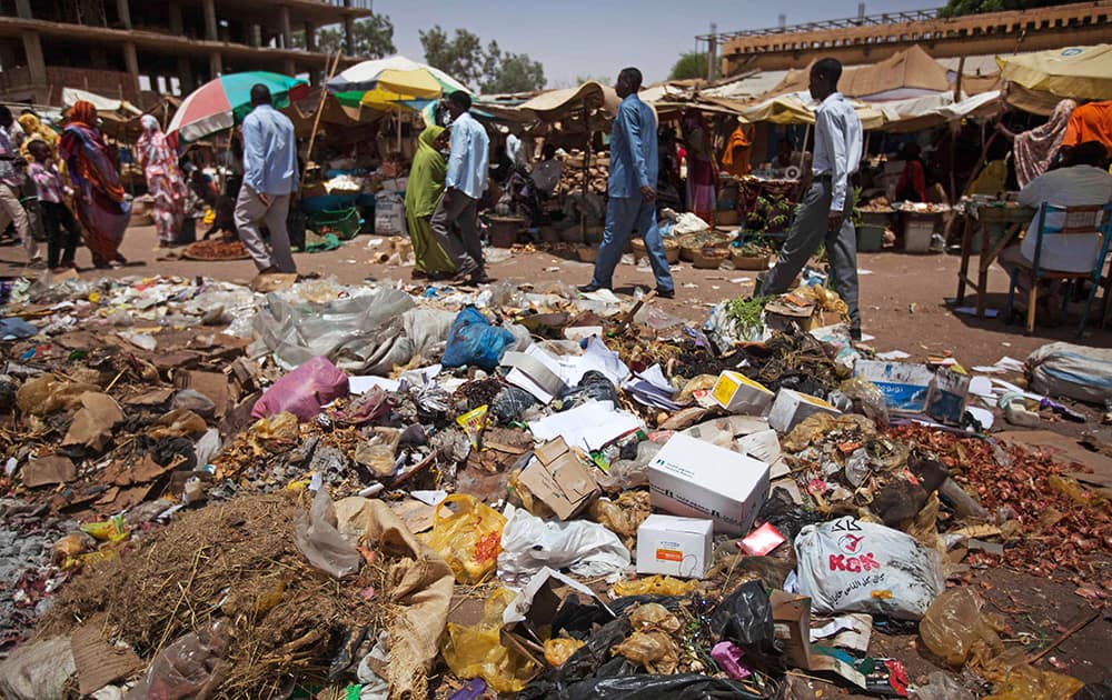 People walk at a market in El Fasher, North Darfur, Sudan. June 5 is observed by the United Nations as World Environment Day.