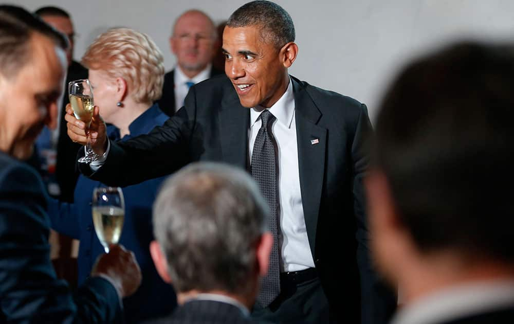 President Barack Obama toasts European leaders as he attends a dinner at the Royal Castle in Warsaw, Poland.