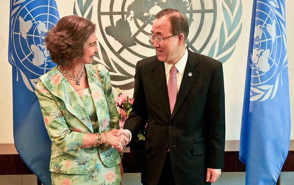 Spain`s Queen Sofia, left, and U.N. Secretary-General Ban Ki-Moon, shake hands for photographers as they pose following her address to the triannual session of the UNICEF executive board, at U.N. headquarters.