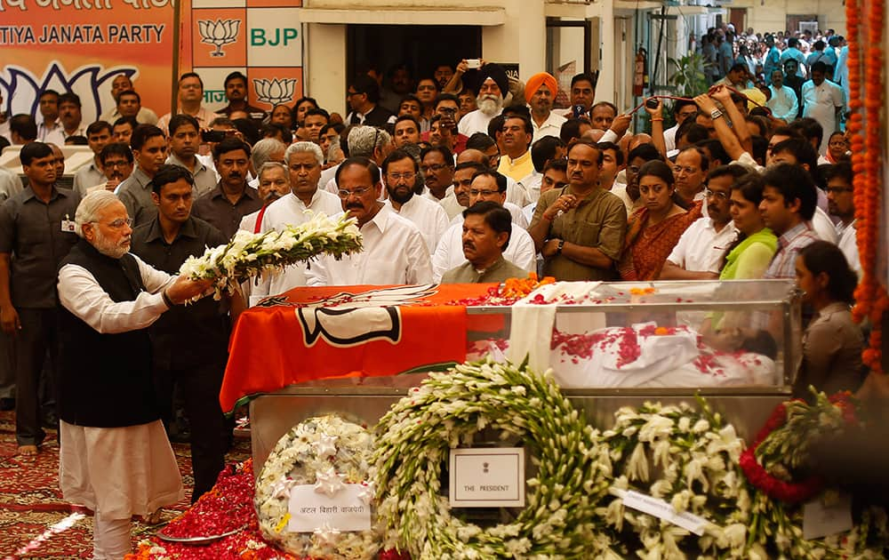 Prime Minister Narendra Modi places a wreath as he pays tribute to India`s Rural Affairs Minister Gopinath Munde in New Delhi. Munde was killed in a car accident Tuesday in New Delhi.