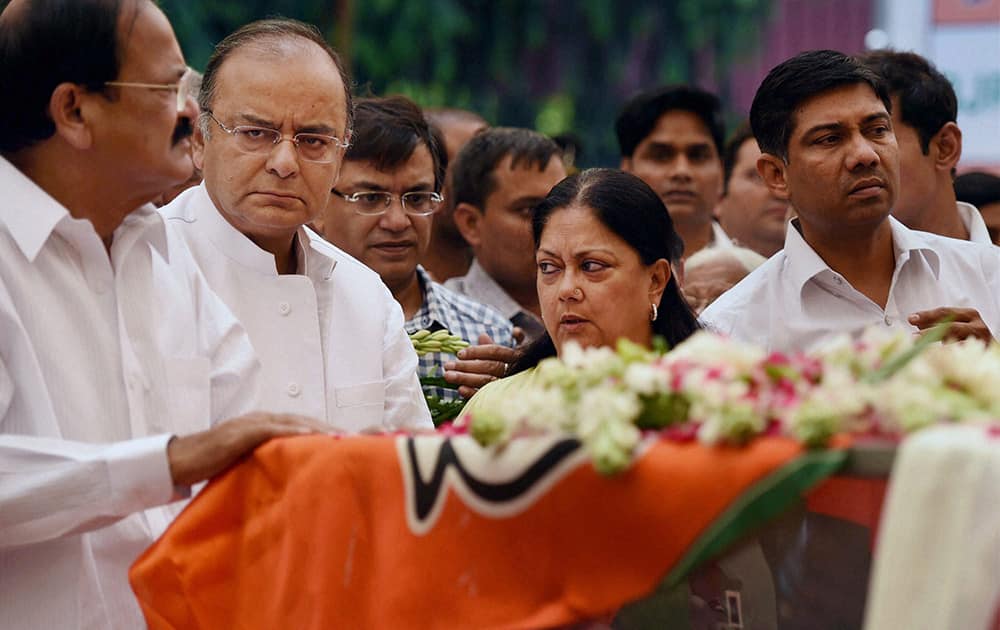 Union ministers M Venkaiah Naidu, Arun Jaitley and Rajasthan CM Vasundhara Raje while paying their last respect to the mortal remains of Union minister Gopinath Munde at the BJP headquarters in New Delhi on Tuesday. Munde died on Tuesday morning in a road accident in New Delhi.