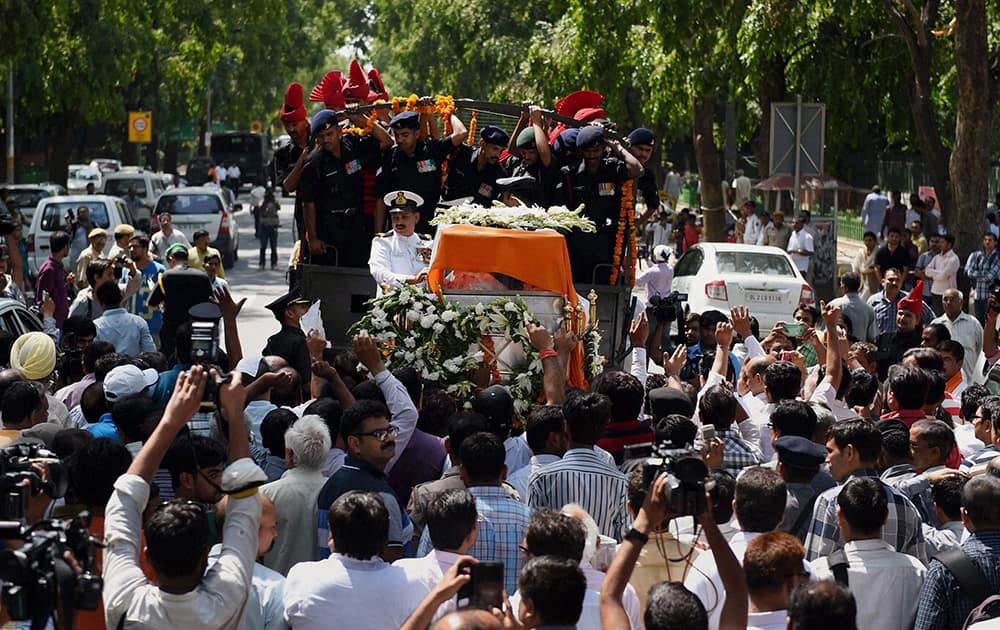 The mortal remains of Union minister Gopinath Munde is brought at the BJP headquarters in New Delhi on Tuesday. Munde died on Tuesday morning in a road accident in New Delhi.