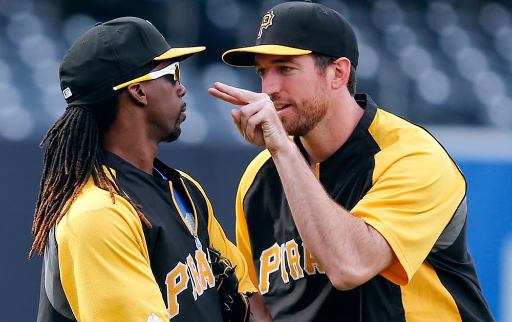 Pittsburgh Pirates` Ike Davis, right, lets Andrew McCutchen knows he is jokingly watching him before a baseball game against the San Diego Padres.