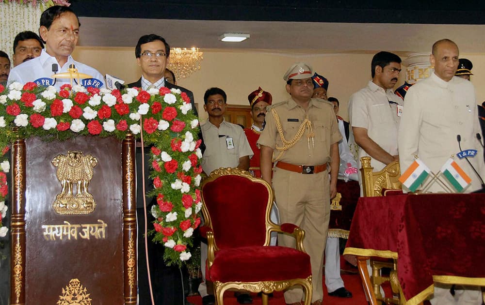 Andhra Pradesh Governor Narshimham administering oath of the Chief Minister of new state Telangana to TRS President, K Chandrasekhar Rao during the swearing-in ceremony at Raj Bhavan in Hyderabad.