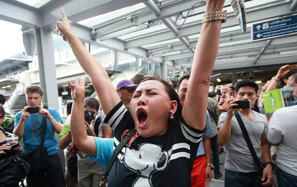 A protester shouts during an anti-coup demonstration at an overpass in Bangkok, Thailand. Hundreds of demonstrators shouting `Freedom!` and 