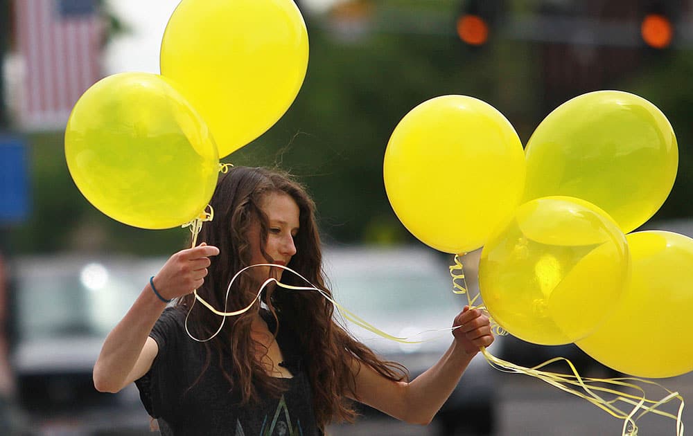 Rachel Malone ties balloons along Main Street in Hailey, Idaho after the announcement that US Army Sgt. Bowe Bergdahl has been released from captivity. Bergdahl, 28, had been held prisoner by the Taliban since June 30, 2009. 