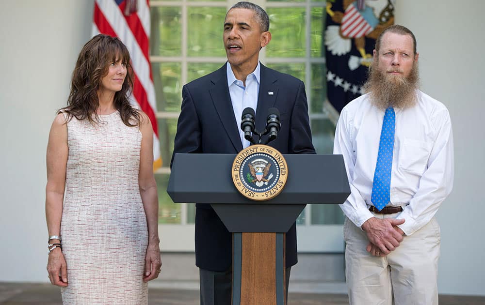 President Barack Obama, accompanied by Jani Bergdahl, left, and Bob Bergdahl, speaks during a news conference in the Rose Garden of the White House in Washington on Saturday, May 31, 2014 about the release of their son, US Army Sgt. Bowe Bergdahl. Bergdahl, 28, had been held prisoner by the Taliban