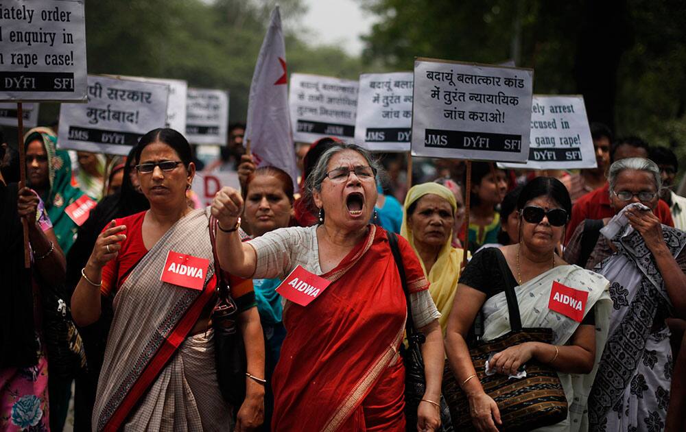 Members of the All India Democratic Women`s Association (AIDWA) shout slogans during a protest against the gang rape of two teenage girls, in New Delhi.