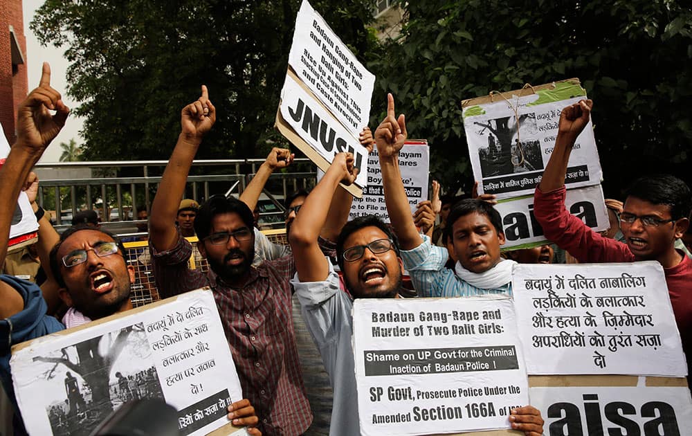 Members of Jawaharlal Nehru University Students Union shout slogans during a protest against a gang rape of two teenage girls in Katra village, outside the Uttar Pradesh state house, in New Delhi.