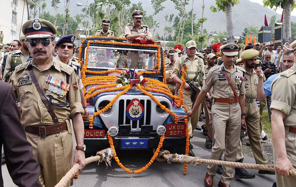 Outgoing DGP of Jammu and Kashmir Ashoke Prasad being given a ceremonial send off during his farewell prade at Armed Police Complex Zewan in Srinagar.