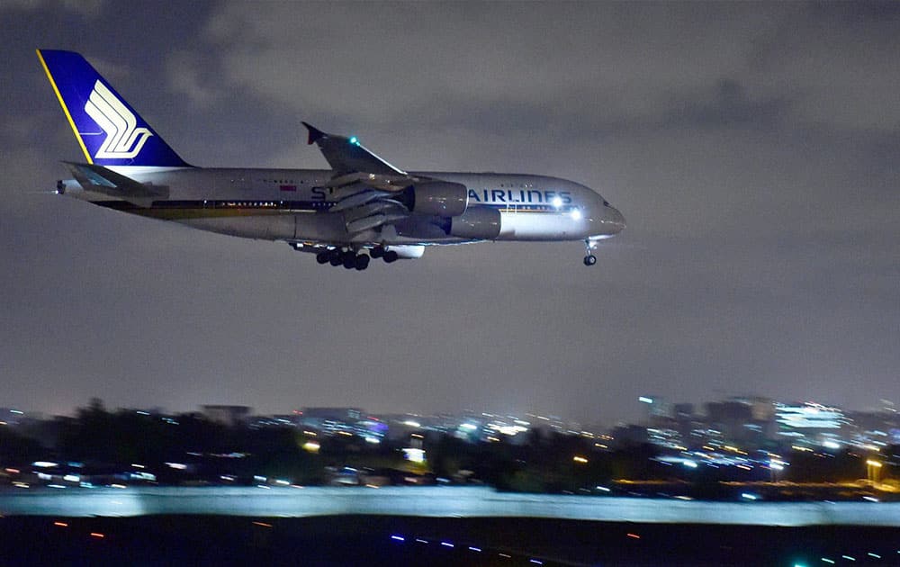 Singapore Airlines` Airbus A380 aircraft prepares to land at the International Airport in Mumbai.