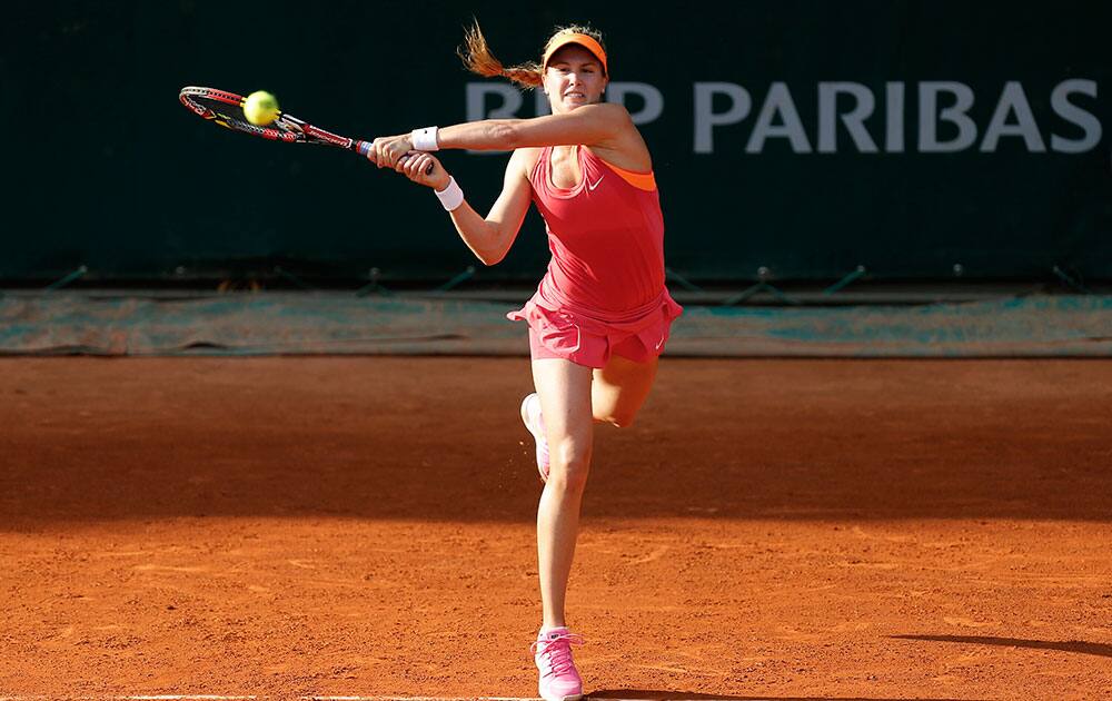 Canada`s Eugenie Bouchard returns the ball during the third round match of the French Open tennis tournament against Sweden`s Johanna Larsson at the Roland Garros stadium, in Paris.