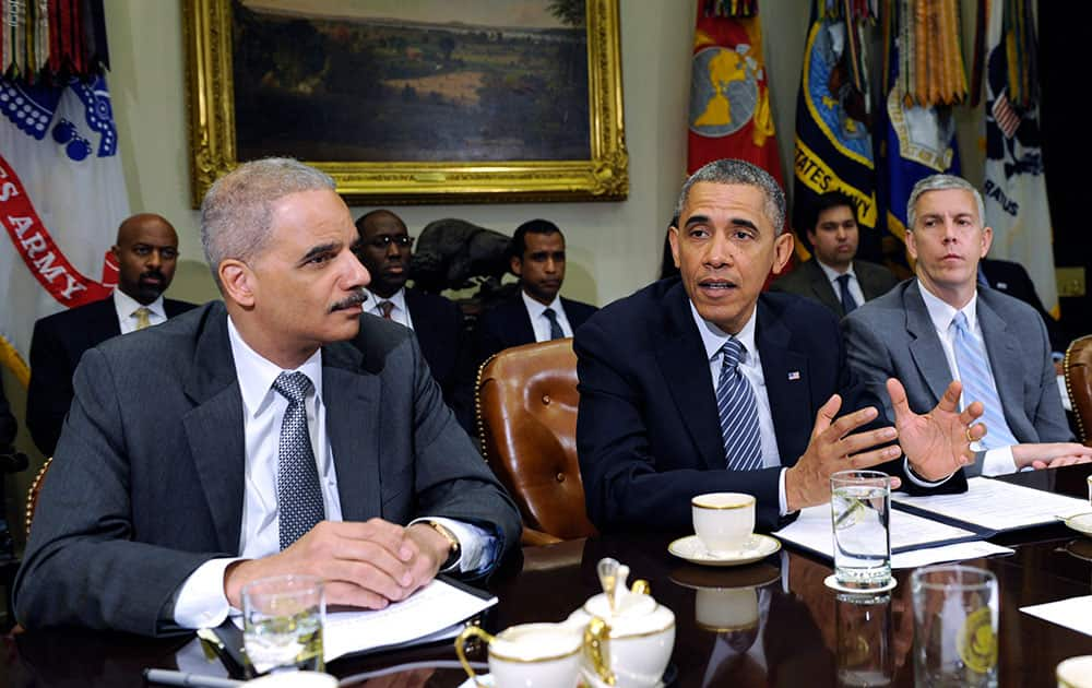 President Barack Obama, flanked by Attorney Holder Eric Holder, and Housing and Urban Development Secretary Shaun Donovan, speaks about a report from `My Brother`s Keeper,` an initiative to expand opportunity for young men and boys of color.