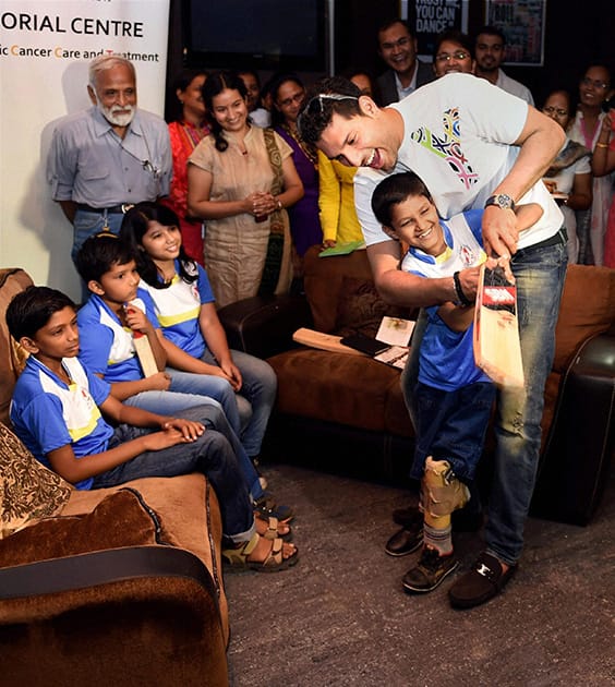 Yuvraj Singh interacts with cancer patient children who will be participating in the `World Children`s Winners Games`, to be held in Moscow, during an event in Mumbai.