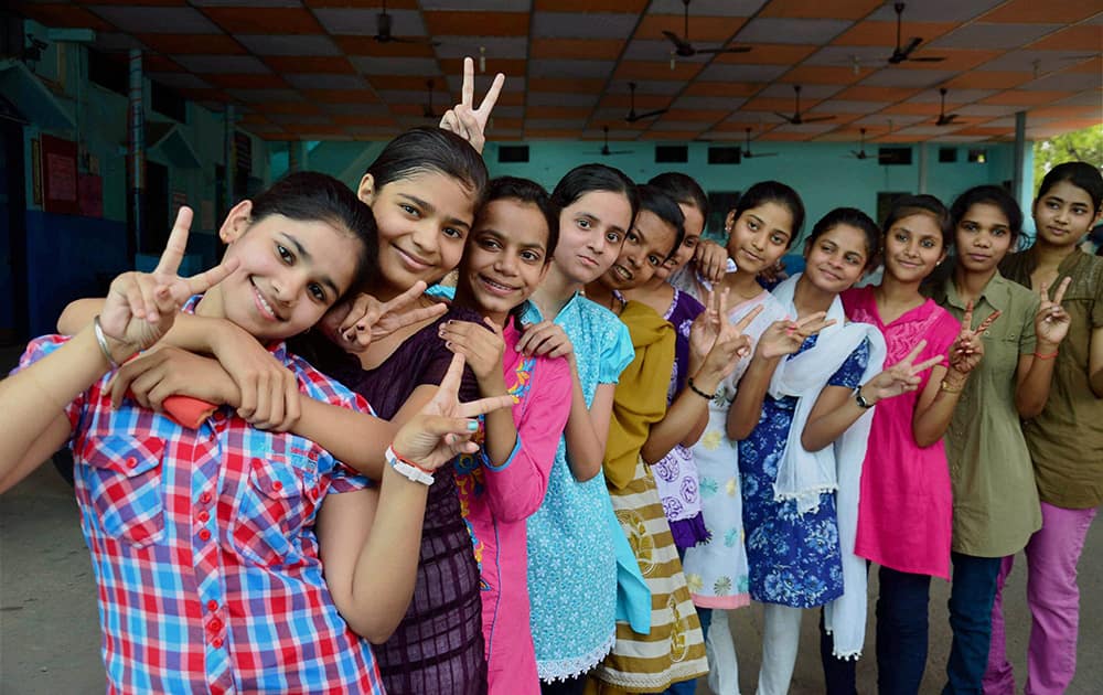 Students celebrate their successes after declaration of UP Board`s 10th class examinations results in Allahabad.