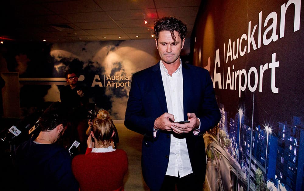 Former New Zealand cricket player Chris Cairns arrives at the Auckland, New Zealand, airport, after returning from London where he was interviewed by the Metropolitan Police and investigators from the England and Wales Cricket Board and the ICC`s Anti-Corruption and Security Unit.