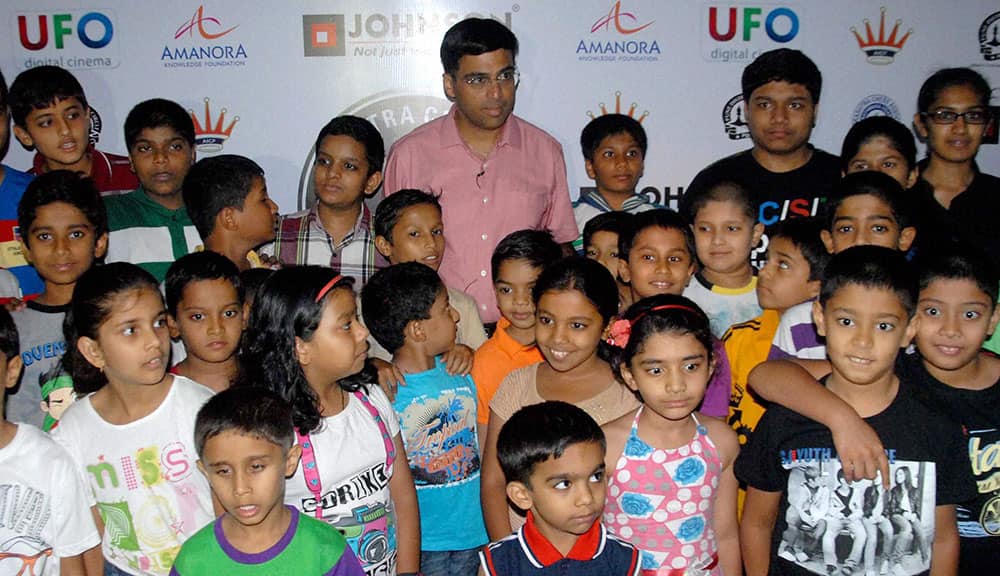 Five time World Chess Champion Viswanathan Anand with his young fans during a press conference of 2nd MCL (Maharashtra Chess League) 2014, in Pune.