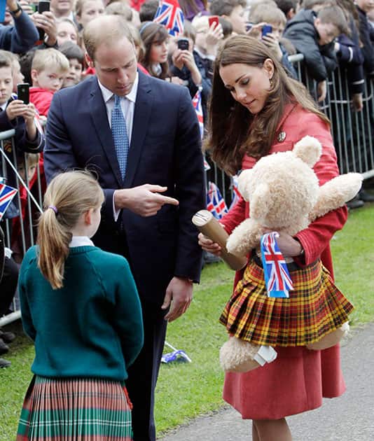 Prince William, left and his wife Kate, the Duke and The Duchess of Cambridge, arrive at the newly-restored MacRosty Park in Crieff, Scotland, where last year the grounds were designated a Queen Elizabeth II field for the enjoyment of the residents of Crieff and the surrounding area.
